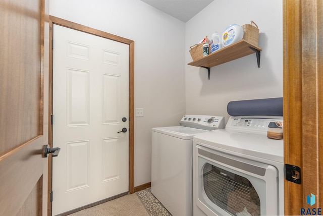 clothes washing area with laundry area and washer and clothes dryer