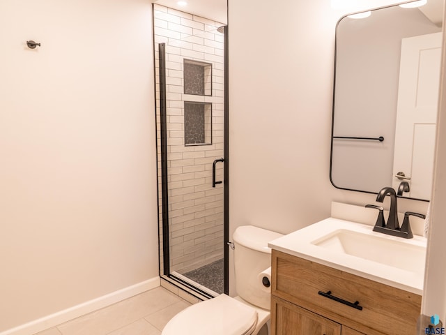 full bathroom with tile patterned flooring, vanity, toilet, baseboards, and a shower stall