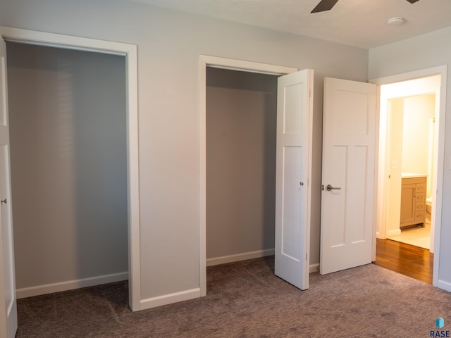 unfurnished bedroom featuring baseboards and carpet