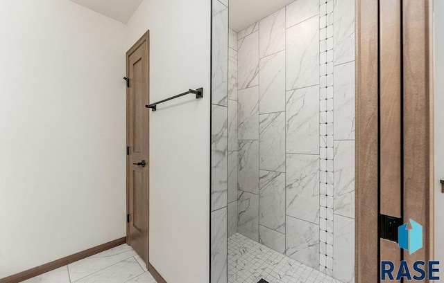 1125 E Wayne Pl, Tea, SD 57064 - full bathroom featuring marble look tiles, a shower stall, and baseboards