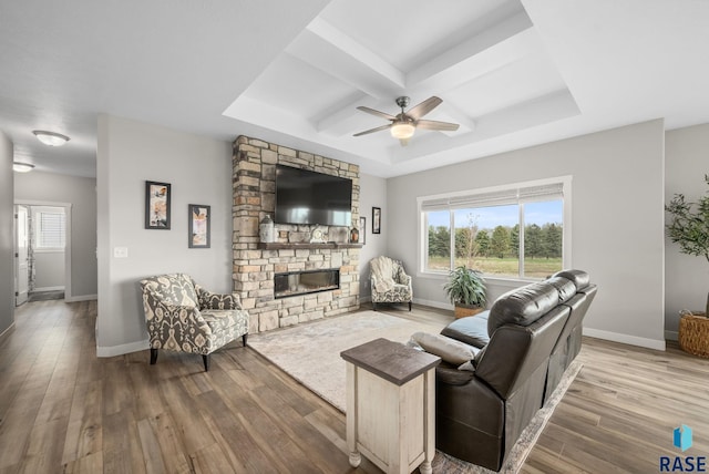 922 Johnson Creek Ct, Harrisburg, SD 57032 - living area with wood finished floors, ceiling fan, plenty of natural light, coffered ceiling, and beam ceiling