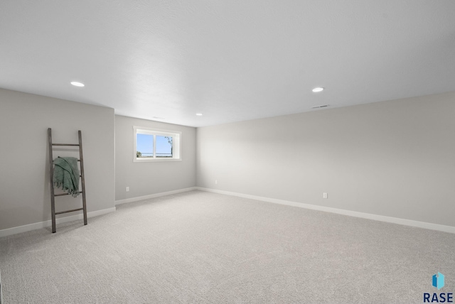 922 Johnson Creek Ct, Harrisburg, SD 57032 - below grade area featuring light colored carpet, recessed lighting, and baseboards