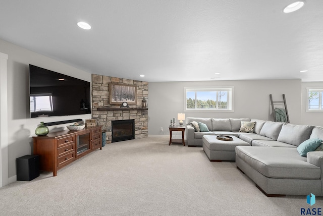 922 Johnson Creek Ct, Harrisburg, SD 57032 - carpeted living room featuring a stone fireplace, recessed lighting, and baseboards
