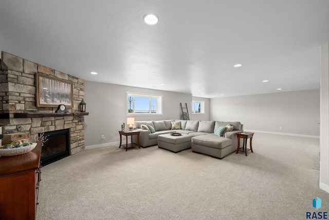 922 Johnson Creek Ct, Harrisburg, SD 57032 - carpeted living room featuring baseboards, a fireplace, and recessed lighting