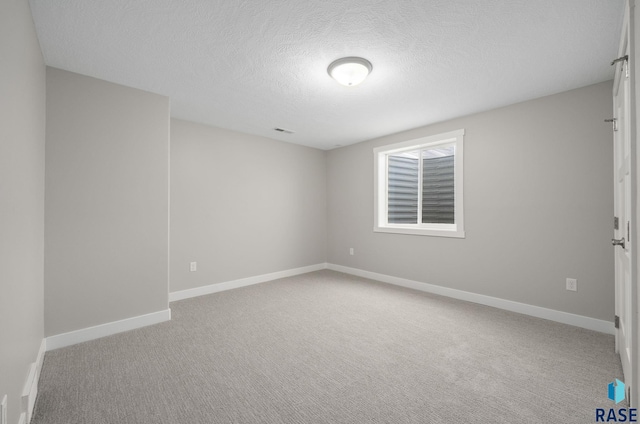 922 Johnson Creek Ct, Harrisburg, SD 57032 - spare room featuring carpet floors, a textured ceiling, and baseboards