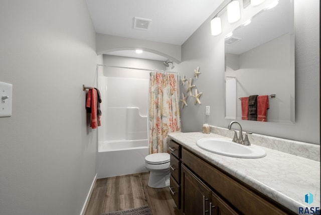 922 Johnson Creek Ct, Harrisburg, SD 57032 - full bathroom featuring wood finished floors, toilet, vanity, shower / bath combo with shower curtain, and baseboards
