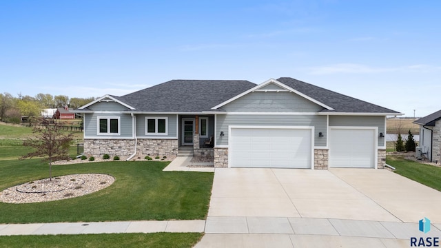 922 Johnson Creek Ct, Harrisburg, SD 57032 - craftsman house with a garage, concrete driveway, a front yard, stone siding, and a shingled roof