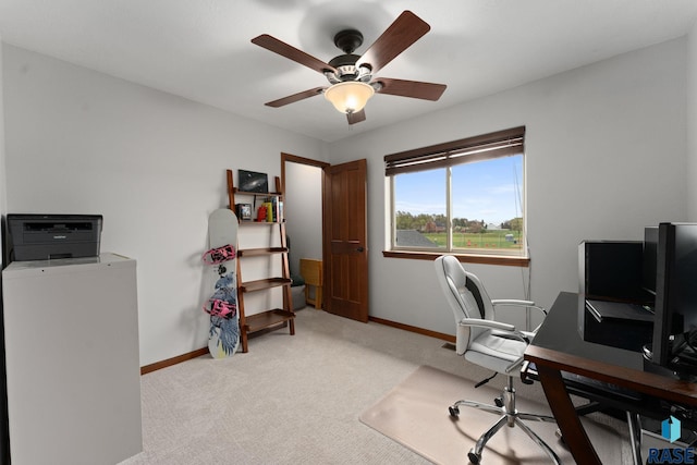 office space featuring baseboards, carpet flooring, and ceiling fan