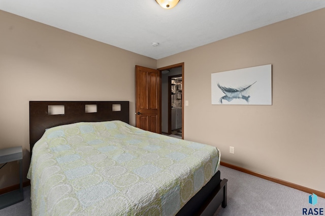 carpeted bedroom featuring baseboards