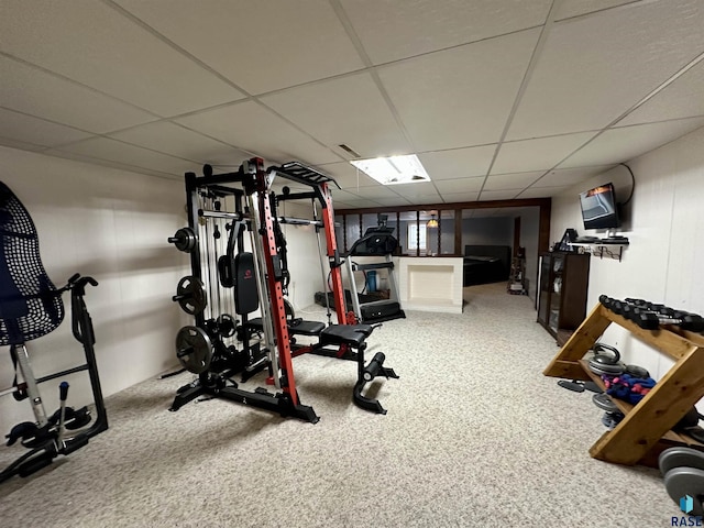 exercise area featuring a drop ceiling