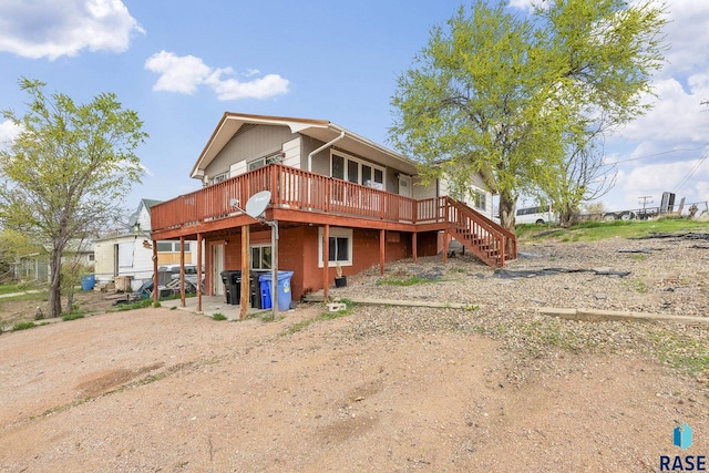 1019 Herman St, Rapid City, SD 57701 - back of house featuring a wooden deck and stairs