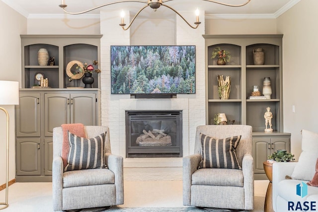 living area with ornamental molding, a fireplace, and built in shelves