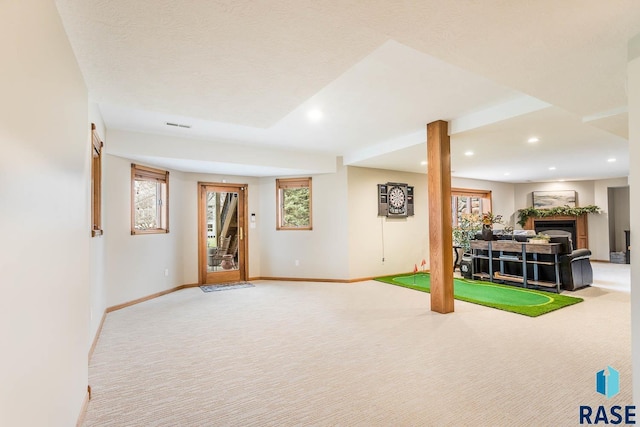 game room featuring carpet floors, recessed lighting, baseboards, and a fireplace