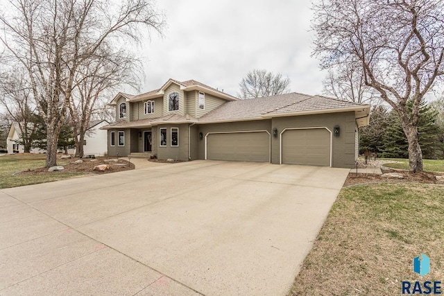 view of front of home featuring a garage and driveway