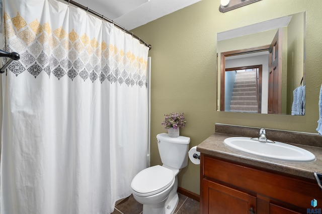 bathroom with toilet, tile patterned floors, a shower with shower curtain, and vanity