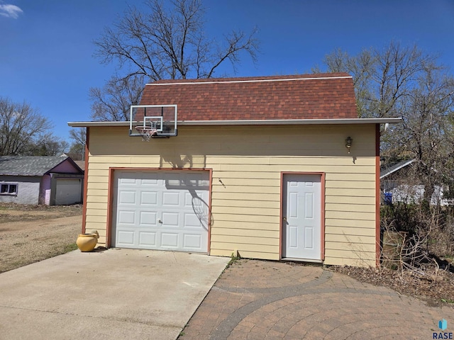 garage with concrete driveway