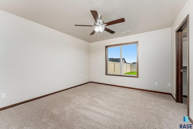 5714 S Woodlily Ave, Sioux Falls, SD 57108 - unfurnished room with light colored carpet, visible vents, baseboards, and ceiling fan