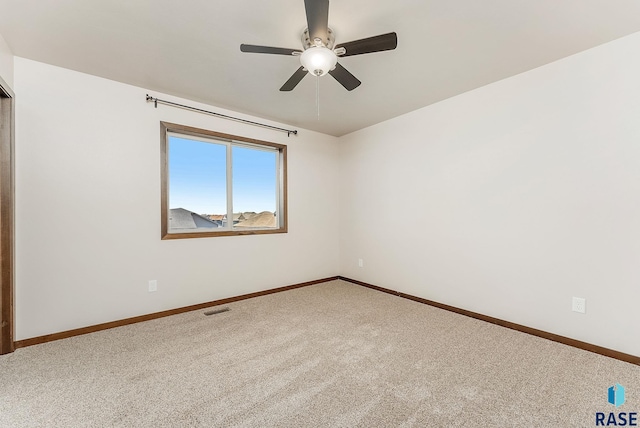 5714 S Woodlily Ave, Sioux Falls, SD 57108 - empty room with carpet flooring, baseboards, a ceiling fan, and visible vents