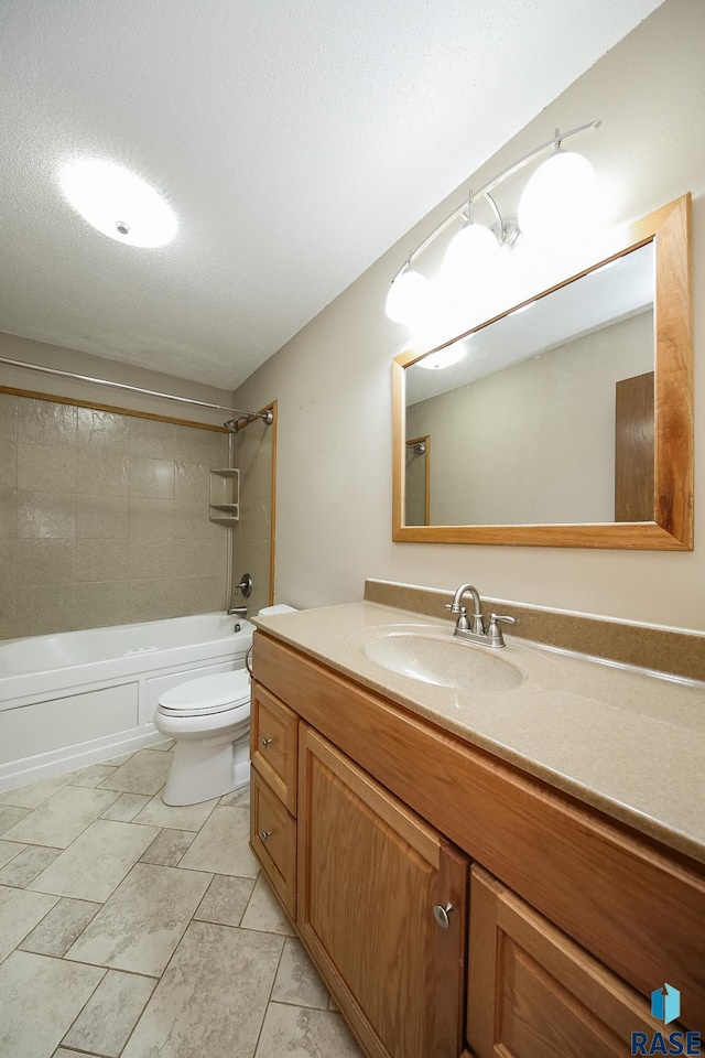 full bathroom featuring toilet, vanity, and bathtub / shower combination