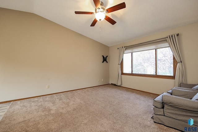 unfurnished room with light colored carpet, baseboards, lofted ceiling, and ceiling fan
