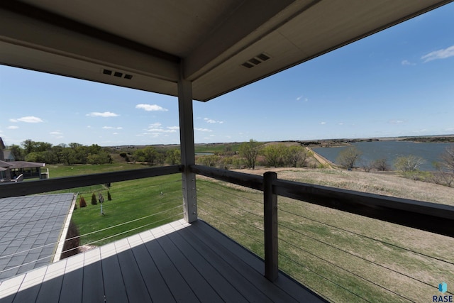 wooden deck featuring a water view