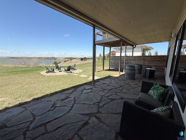view of patio / terrace featuring an outdoor fire pit and fence