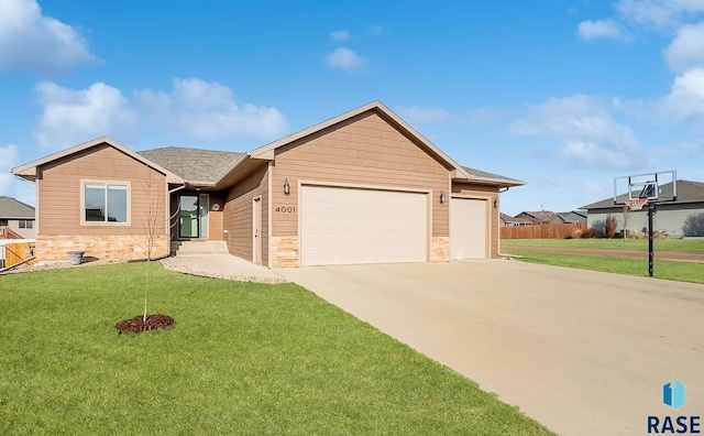 single story home with concrete driveway, stone siding, an attached garage, and a front yard