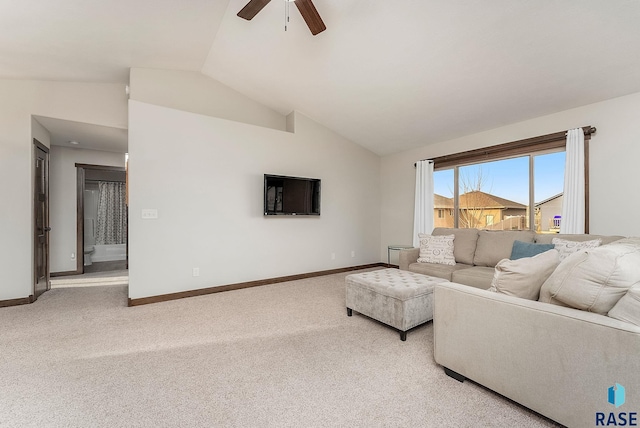 carpeted living area featuring vaulted ceiling, ceiling fan, and baseboards