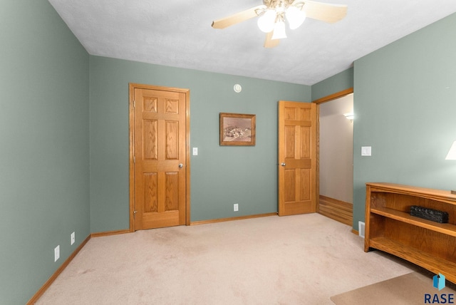 bedroom featuring carpet, baseboards, and a ceiling fan