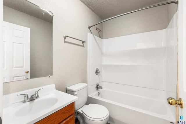 bathroom featuring toilet, a textured ceiling, vanity, and shower / bathing tub combination