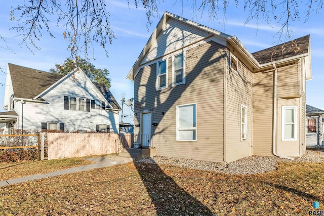 view of home's exterior featuring fence