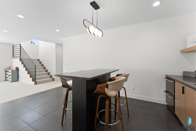 112 N Harvest Hill Cir, Sioux Falls, SD 57110 - dining room with recessed lighting, dark tile patterned floors, and stairs