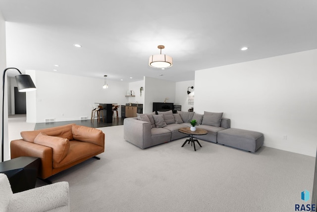112 N Harvest Hill Cir, Sioux Falls, SD 57110 - carpeted living area with visible vents and recessed lighting