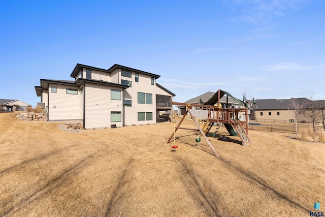 112 N Harvest Hill Cir, Sioux Falls, SD 57110 - rear view of property with fence and a playground