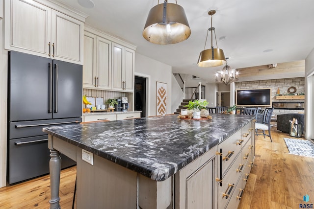 5604 S Jersey Tess Dr, Sioux Falls, SD 57108 - kitchen with light wood finished floors, a center island, high end fridge, open floor plan, and decorative light fixtures