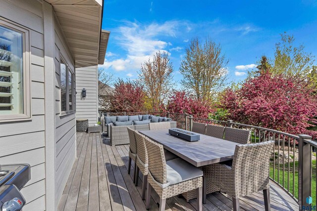 5604 S Jersey Tess Dr, Sioux Falls, SD 57108 - wooden deck with outdoor dining area and an outdoor living space