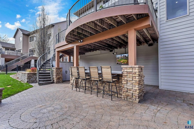 5604 S Jersey Tess Dr, Sioux Falls, SD 57108 - view of patio / terrace featuring outdoor dry bar and stairway