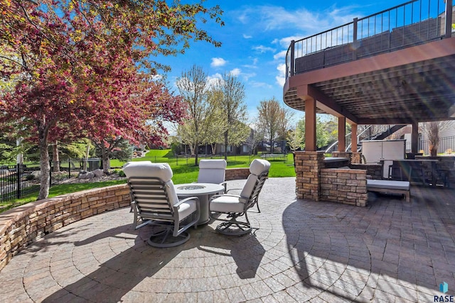 5604 S Jersey Tess Dr, Sioux Falls, SD 57108 - view of patio with a fire pit, fence, area for grilling, and stairs