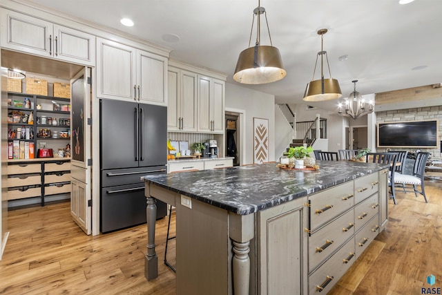 5604 S Jersey Tess Dr, Sioux Falls, SD 57108 - kitchen featuring decorative light fixtures, high end fridge, a chandelier, a kitchen island, and light wood-style floors