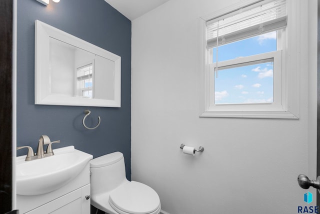 46902 284th St, Lennox, SD 57039 - half bath with toilet, vanity, and plenty of natural light