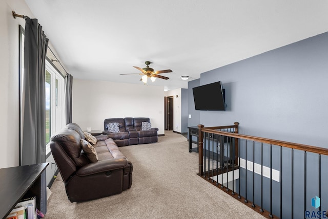 46902 284th St, Lennox, SD 57039 - living room featuring a ceiling fan, baseboards, and carpet floors