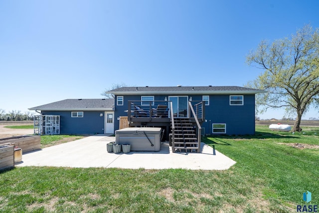 46902 284th St, Lennox, SD 57039 - back of property with a patio, a wooden deck, a hot tub, a yard, and stairs