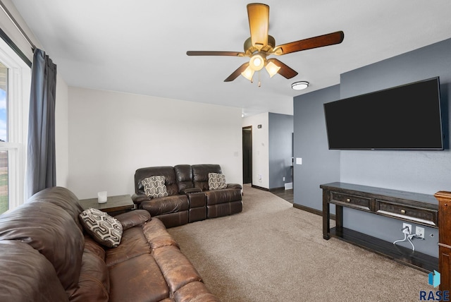 46902 284th St, Lennox, SD 57039 - carpeted living area with ceiling fan and baseboards