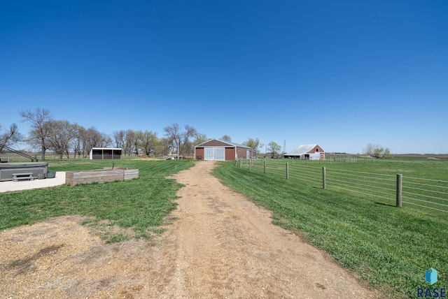 46902 284th St, Lennox, SD 57039 - view of street with a rural view, driveway, and an outbuilding