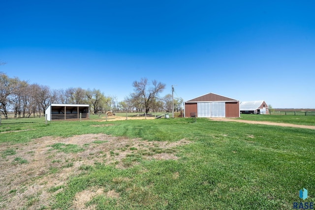 46902 284th St, Lennox, SD 57039 - view of yard with a rural view, an outbuilding, a pole building, and fence