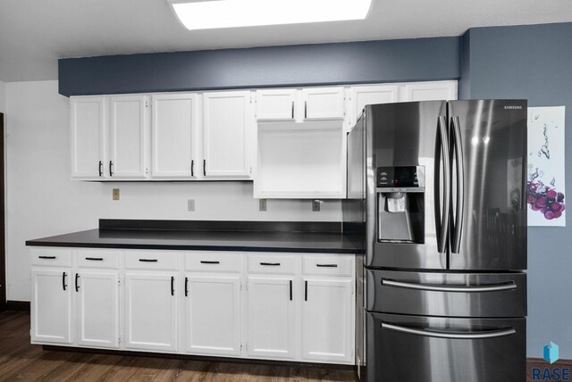 46902 284th St, Lennox, SD 57039 - kitchen featuring dark countertops, white cabinetry, and stainless steel refrigerator with ice dispenser
