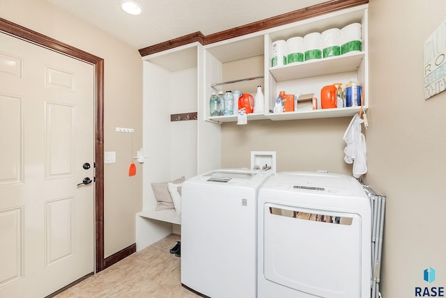 laundry area with washer and dryer and recessed lighting
