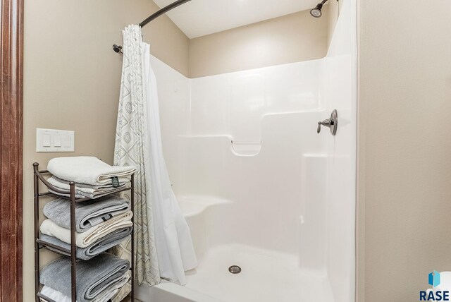 bathroom with a shower stall