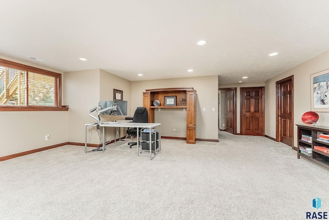 office space featuring baseboards, light colored carpet, and recessed lighting