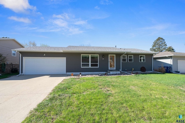 ranch-style home featuring concrete driveway, a front yard, and a garage